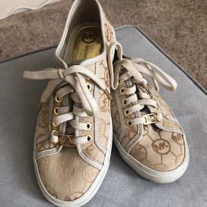 Women’s size 6 Michael Kors gold sneakers